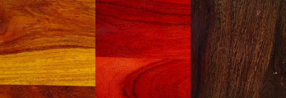 Three wood finish samples: amber, red and dark brown